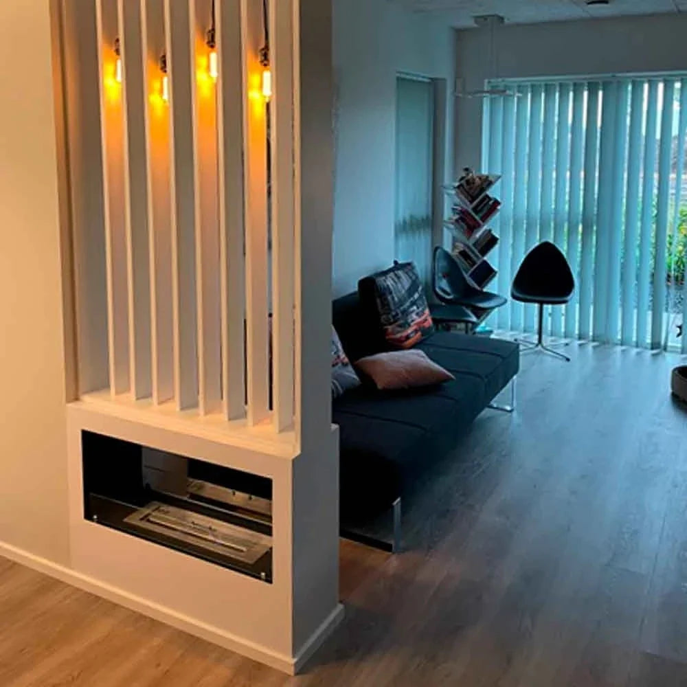 Lansing L White freestanding bio fireplace built into a real customer's slat-wood room divider, unlit, between a hallway and living room