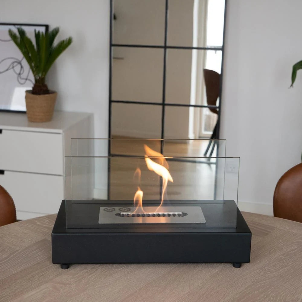 Lambeth black bioethanol fireplace lit on a dining table, genuine customer photo