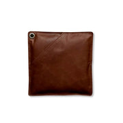Pot holder in dark brown leather, offering heat protection and comfort for handling hot cookware