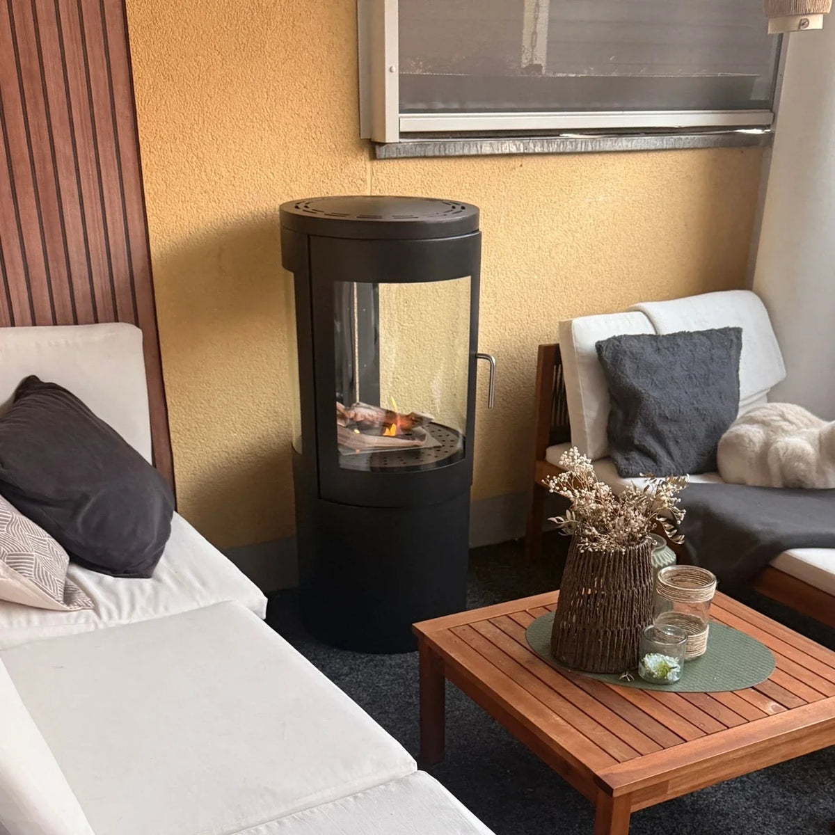 Columbus Bioethanol Stove with 360-View lit on a real customer's balcony